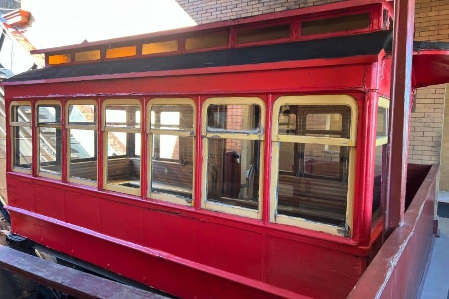 A cable car from the Duquesne Incline. It is a rectangular car with windows and bench seating