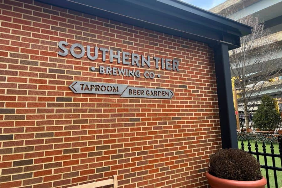A brick building with a sign that says "Southern Tier Brewing Co. Taproom and Beer Garden"